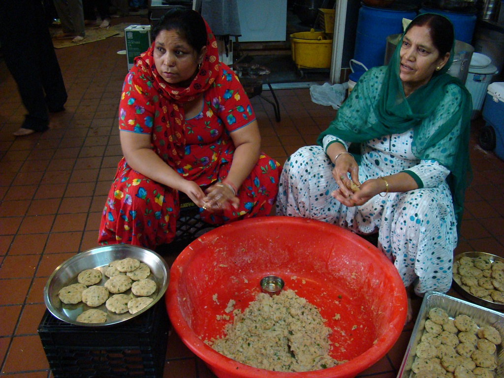 Women at a Sikh gurudwara in New Jersey prepare a langar meal
